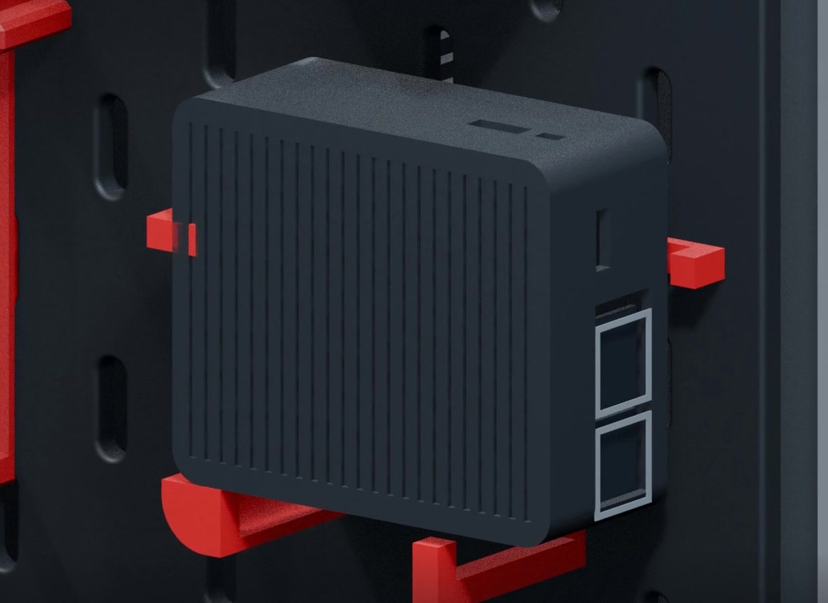 The CM4 router in its finned aluminum DFRobot enclosure, mounted on red brackets